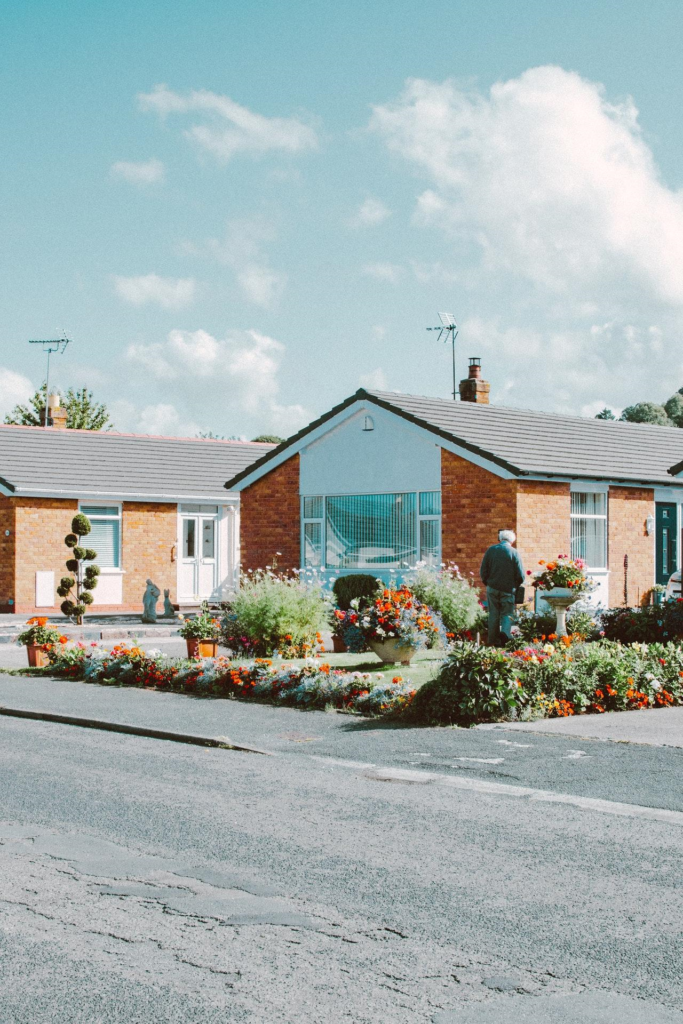 House with garden and an elder man